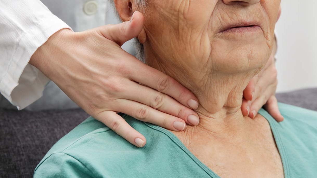 Woman being checked for thyroid problems