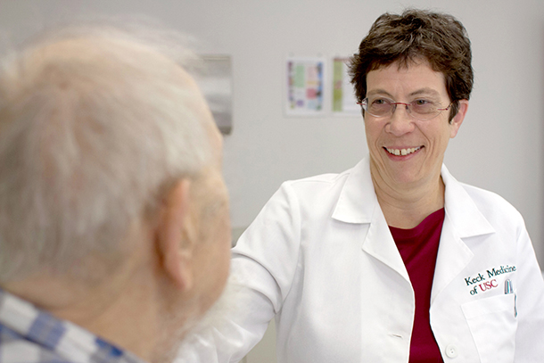 A Doctor speaks to a senior citizen.