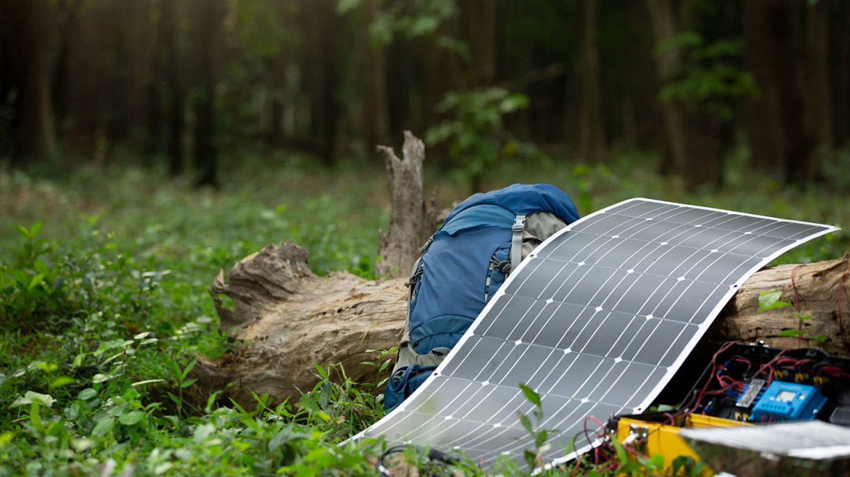 Flexible solar panel outside covering a log