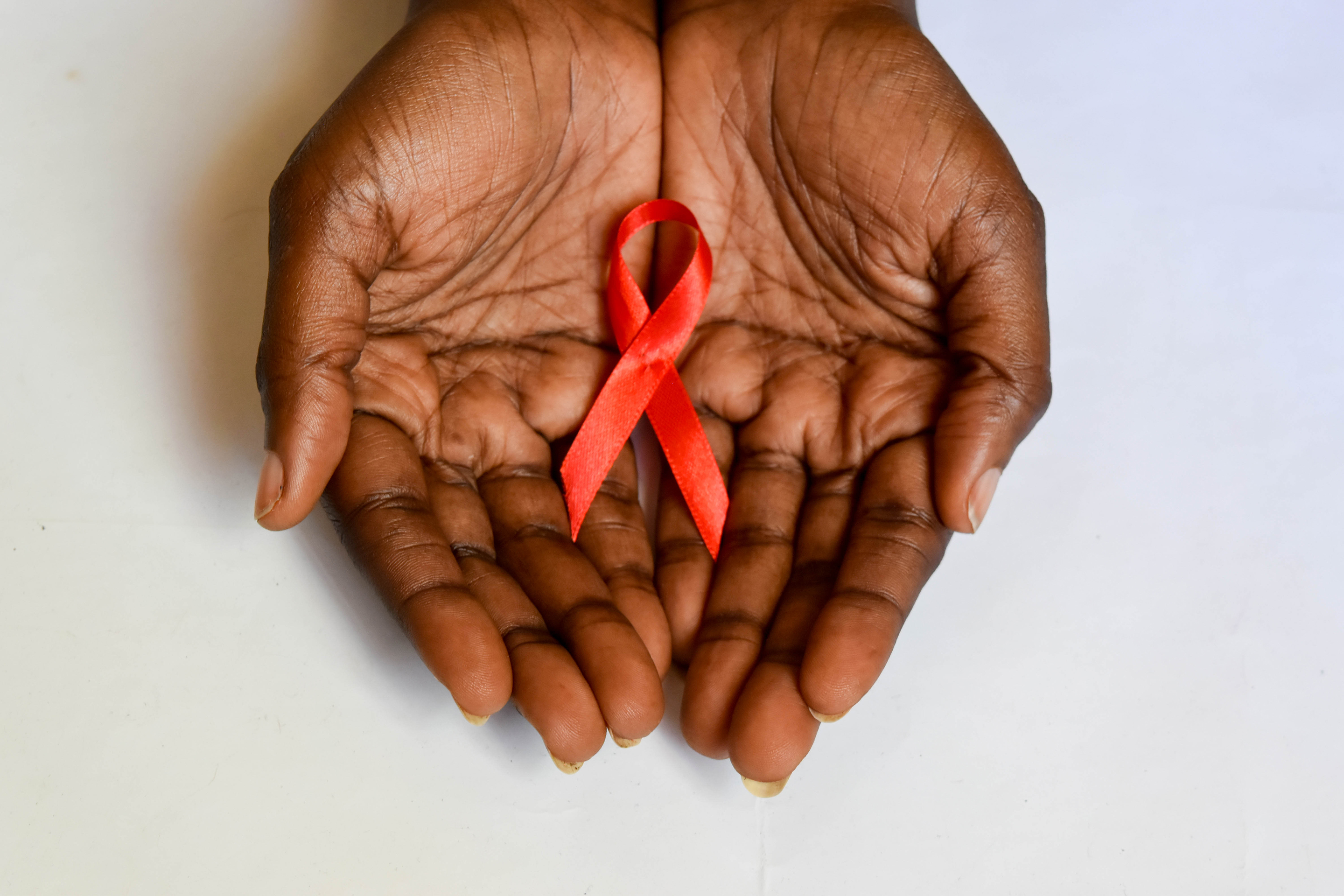 HIV awareness bow in hand