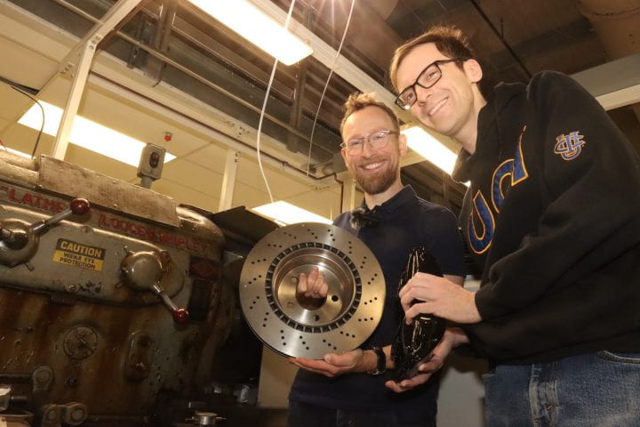Two men with brakes in hand