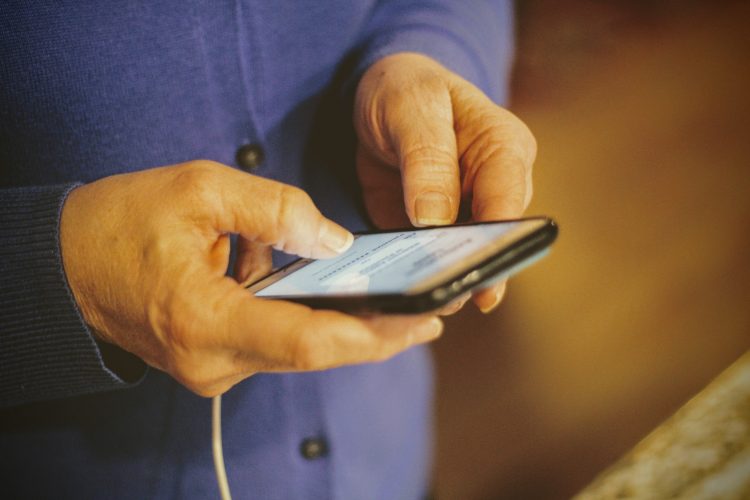 man with smartphone in hand