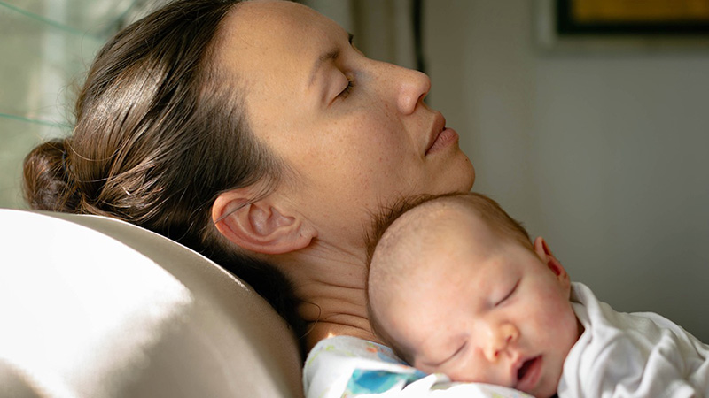 Postpartum insurance, critical women such as this one with her baby