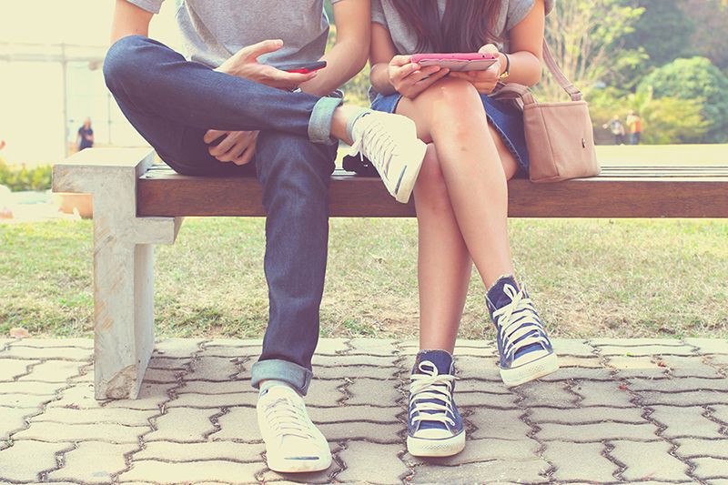 man and woman on their phones