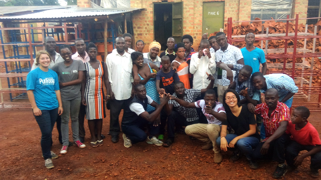 Photo: Kathy Ku (third from right) with SPOUTS team members at the organization's Ugandan production facility.