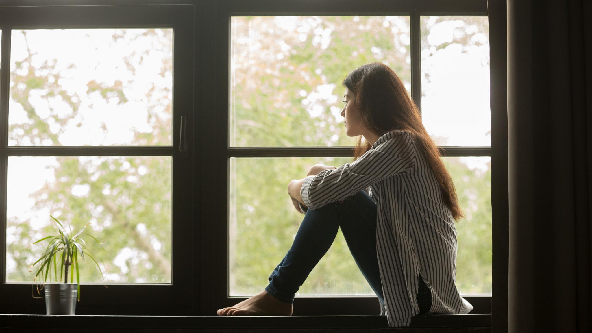 woman sitting by window