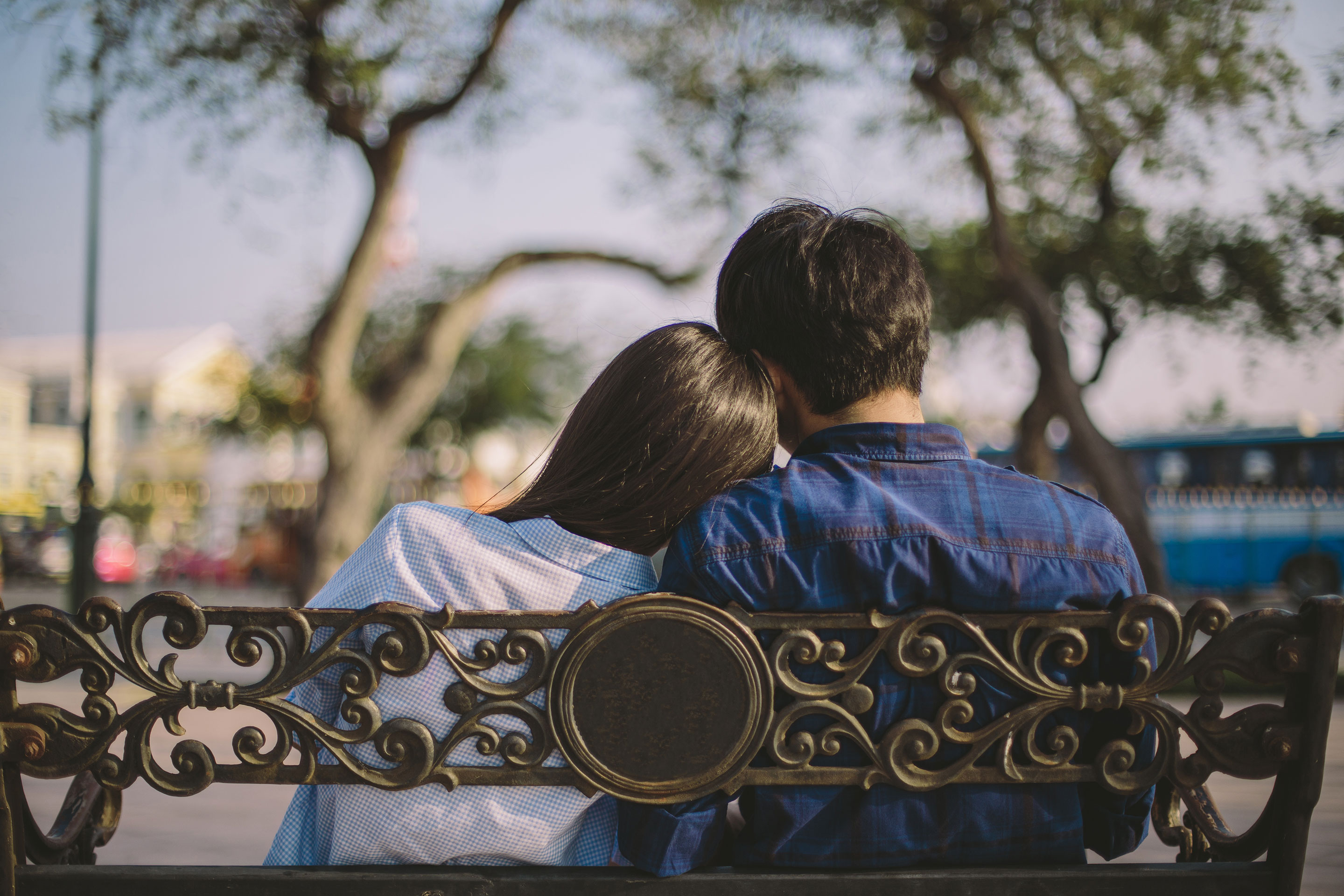 teenagers sitting on a bench