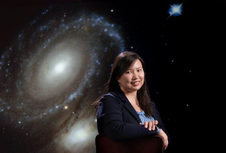 Picture of Vivian U with a picture of the galaxy as the background.