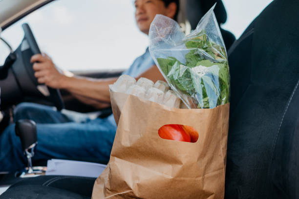 Automobile with groceries in passenger seat - future of autonomous vehicles