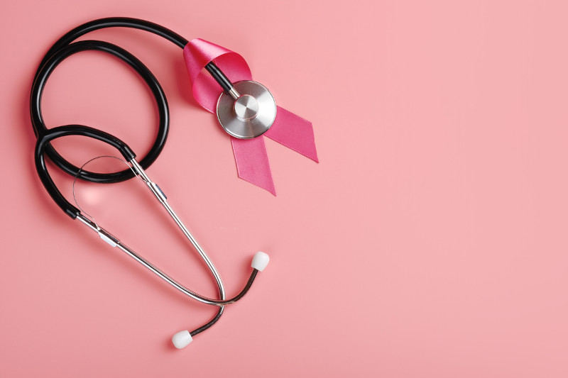 stethoscope with a breast cancer awareness pin - study shows lower risk of breast cancer with sun exposure