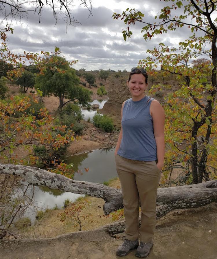 A researcher standing in the field.
