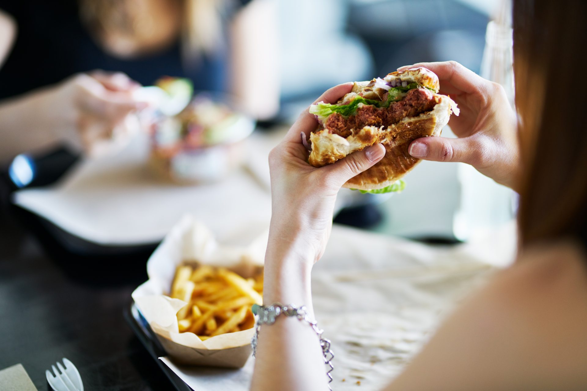 lady eating burger