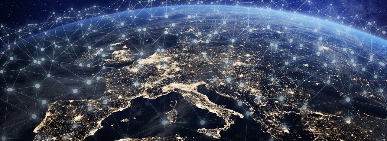 Computer-generated image of the earth with a representation of blockchain communication