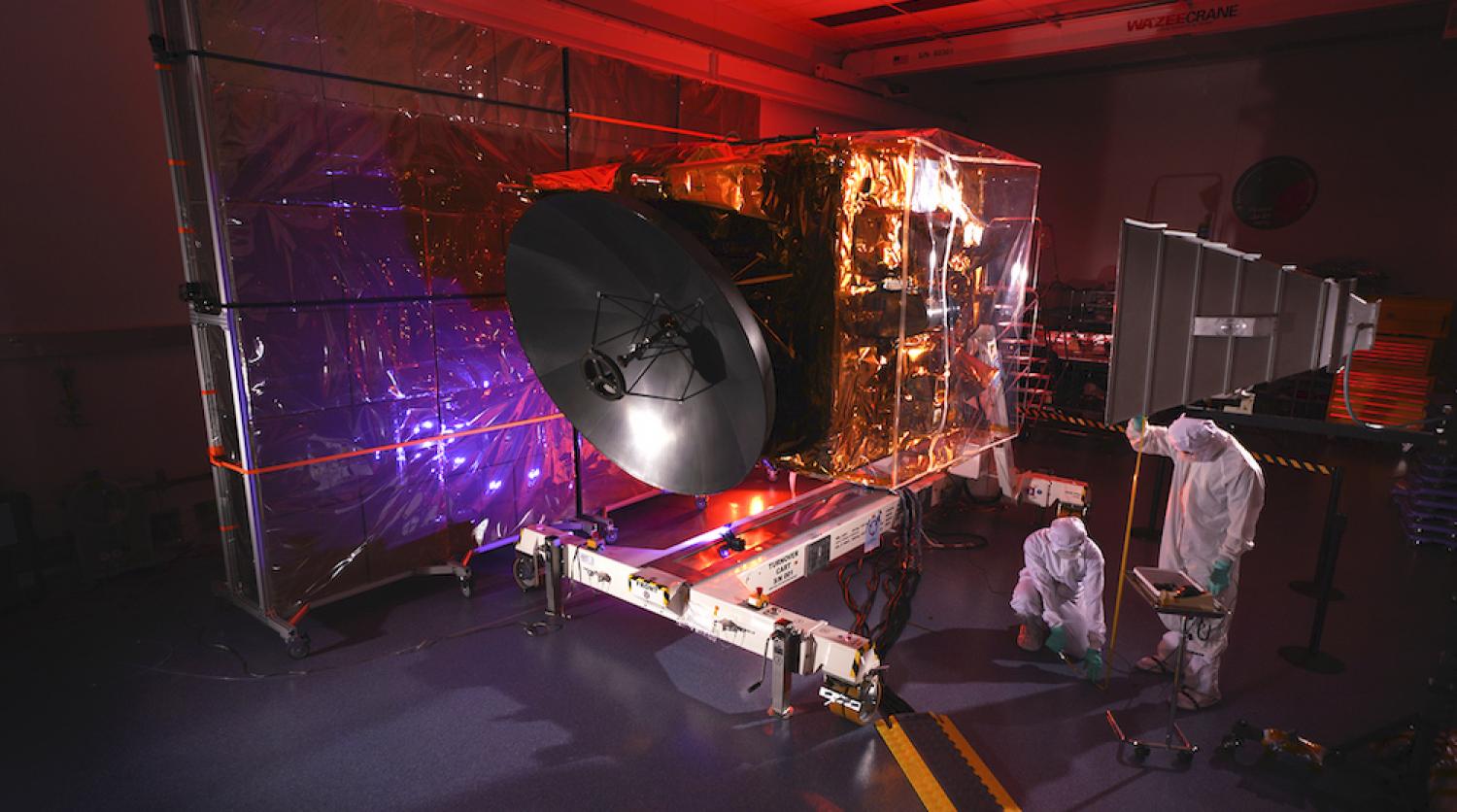 Engineers work on the Hope probe in a cleanroom