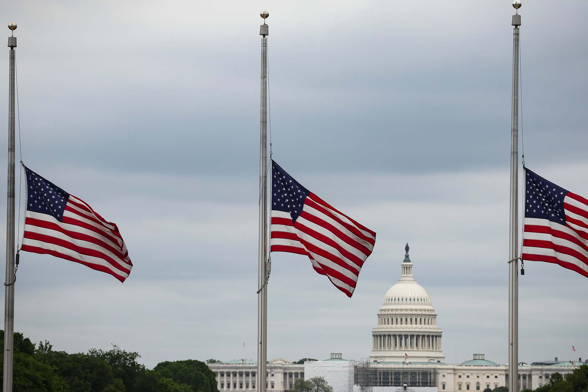 Flags fly at half-staff to commemorate the COVID-19 death toll