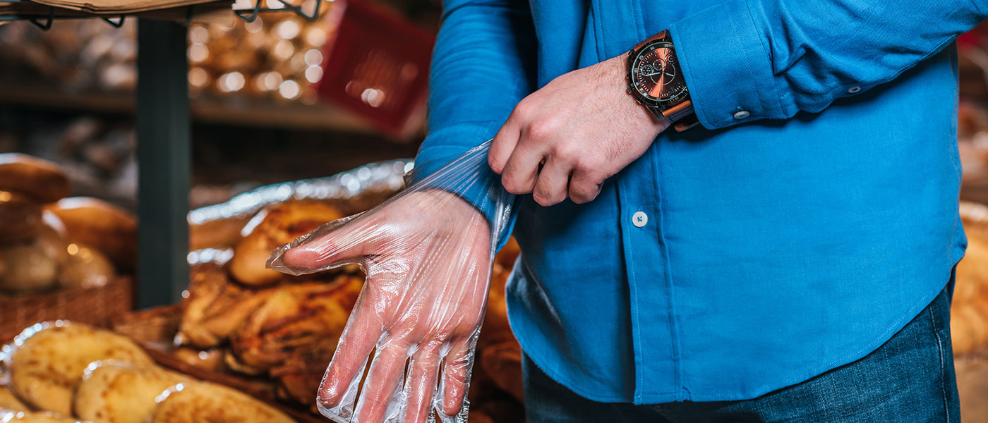 Person putting on a glove