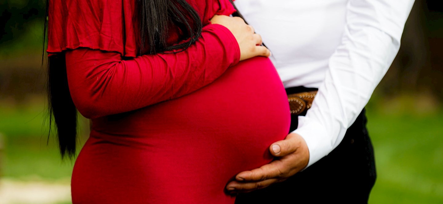 Belly of a pregnant person