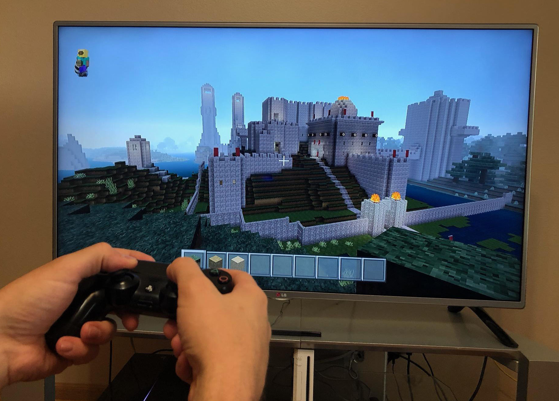 A person builds a neat castle in Minecraft.