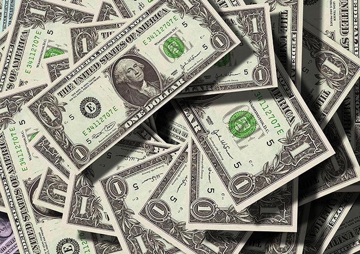 One dollar bills spread out