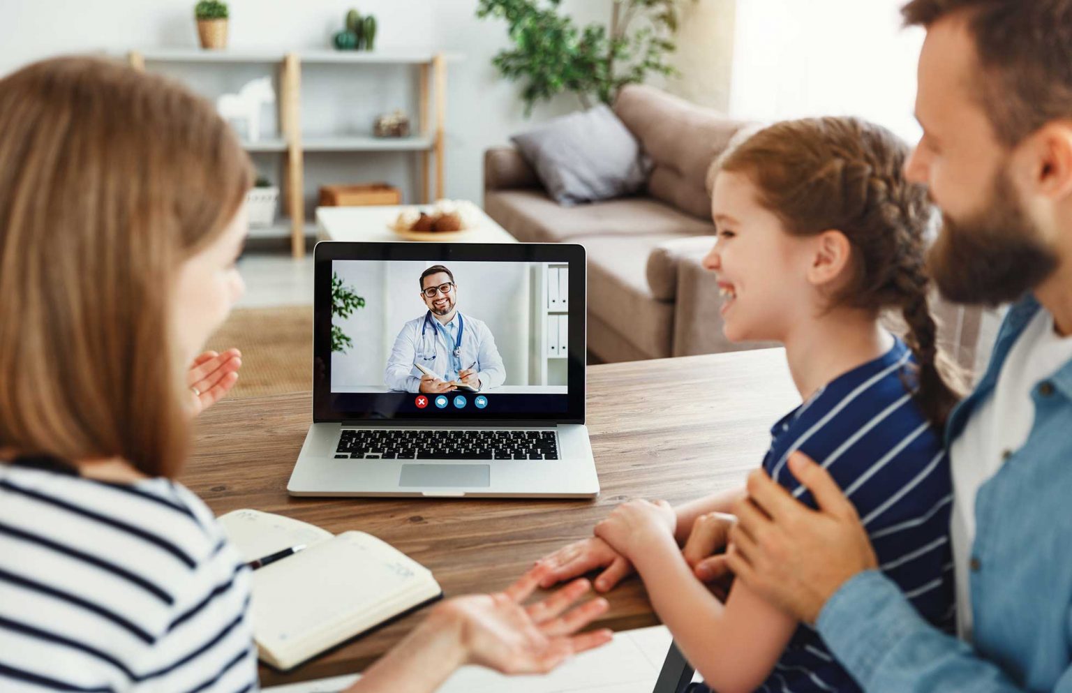 A family consults with a doctor virtually