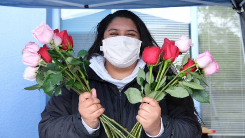 woman holding a bouquet of roses.