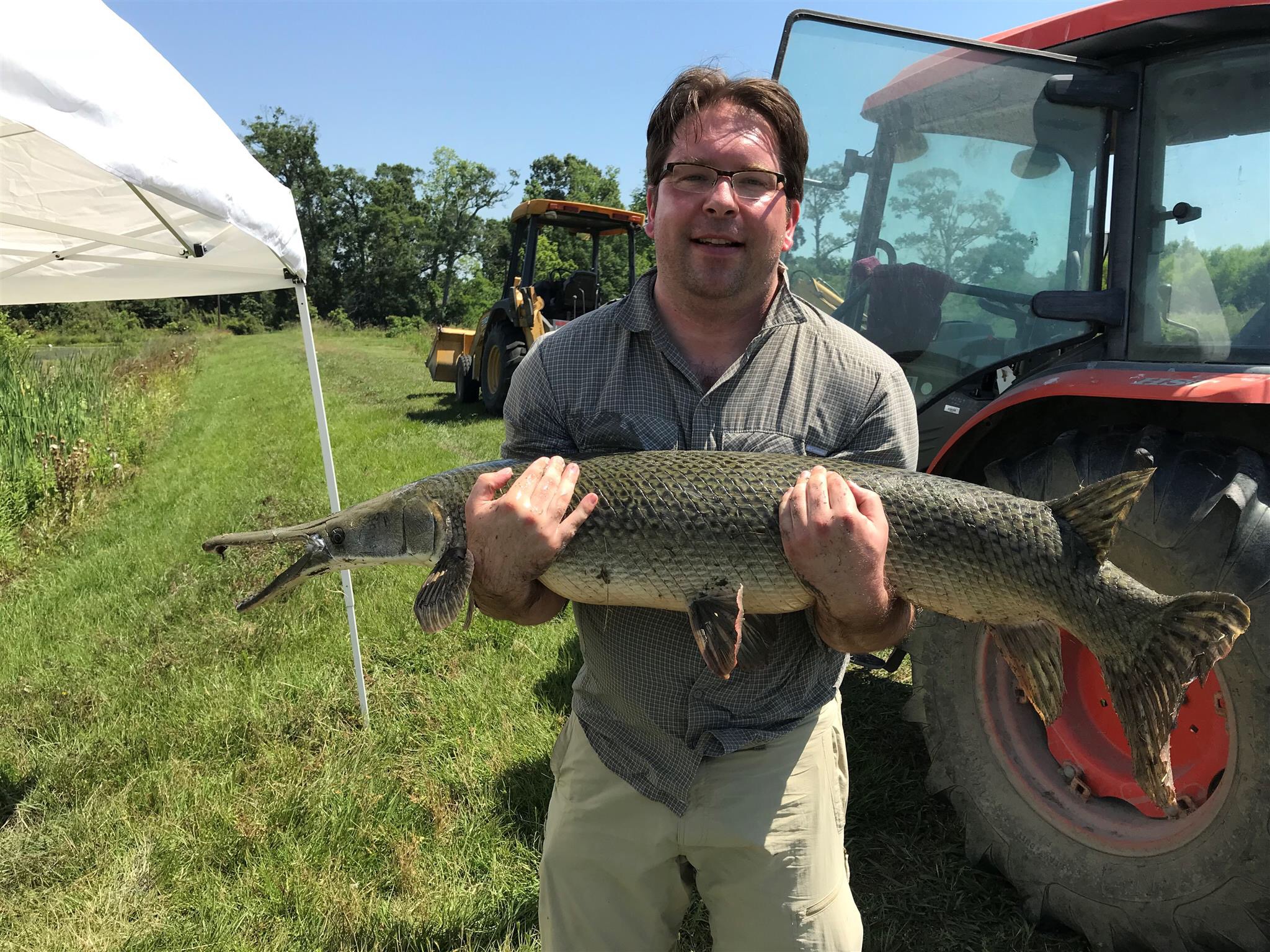 A researcher holds a gar.