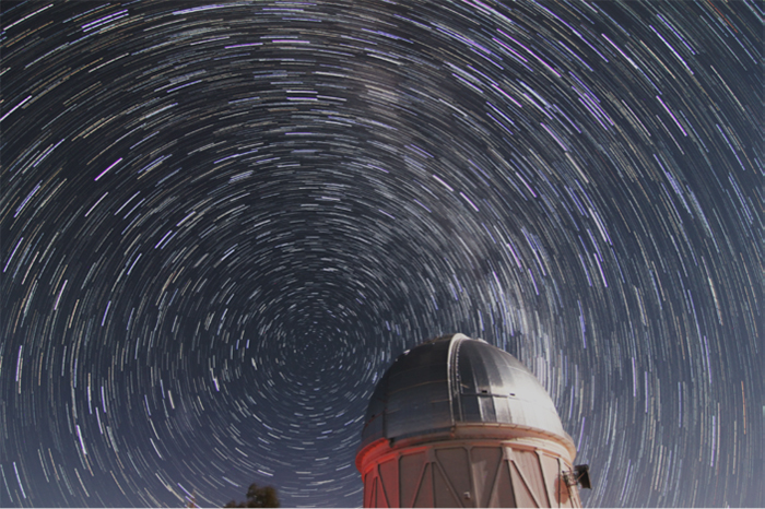 An image of an observatory with stars.