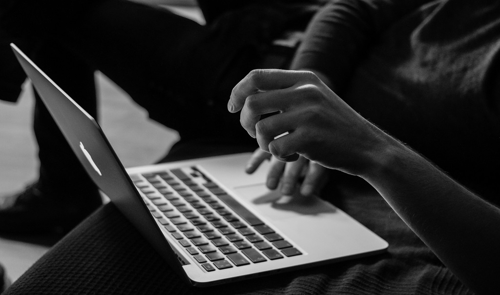 A person uses a Mac computer