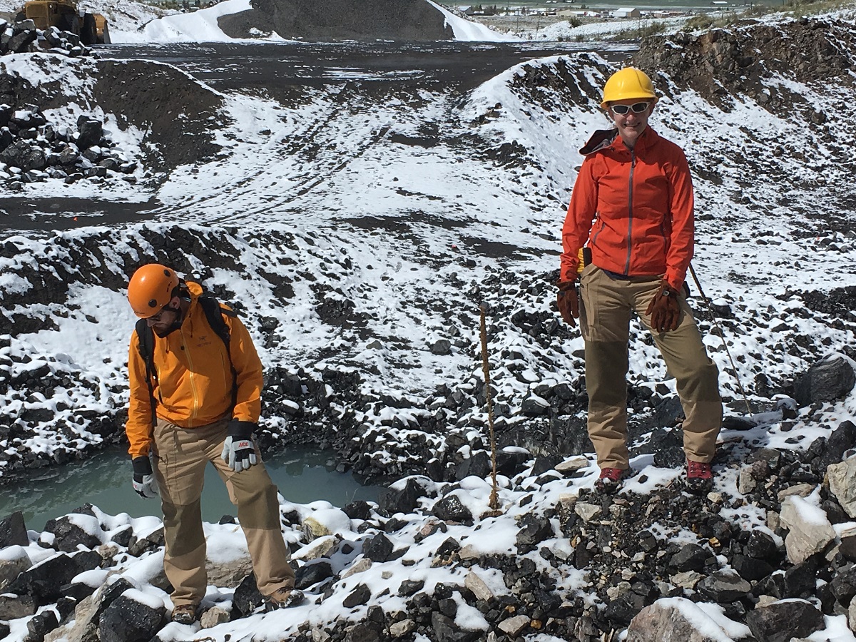 Volcanologists happily posing, unburnt.