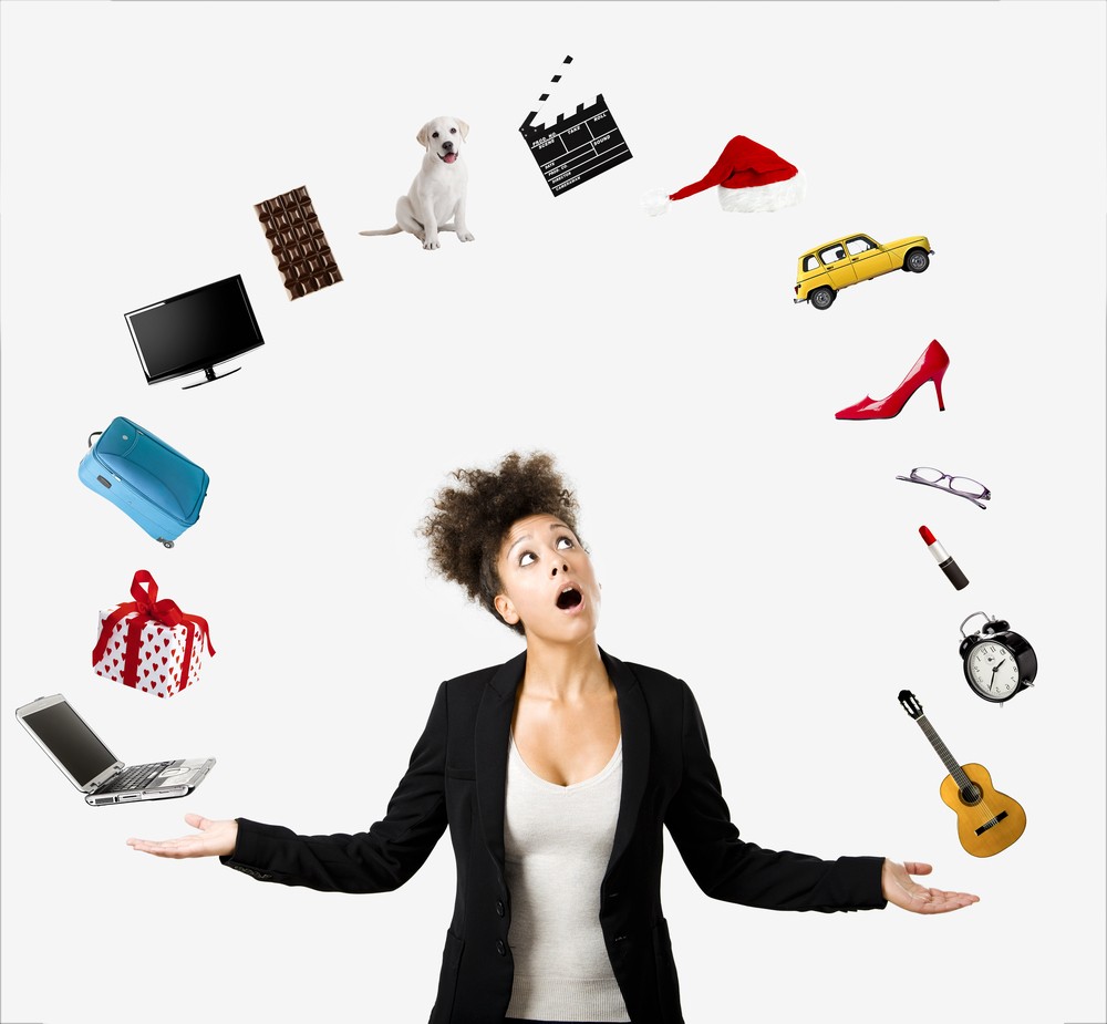 A woman juggles various distractions.