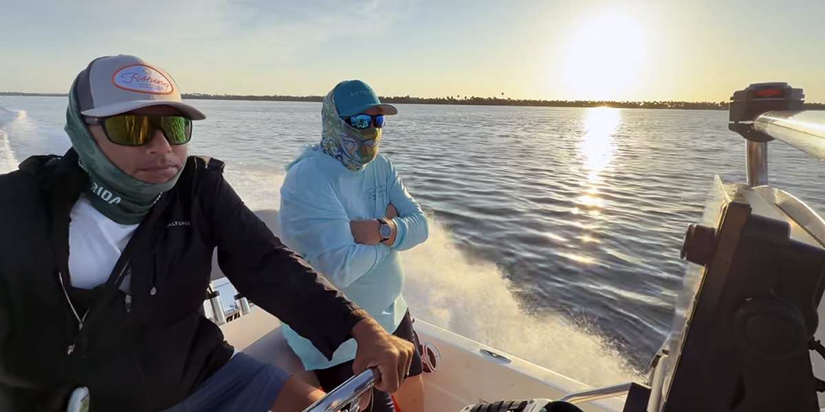 Boat captain and USF researcher on a boat in Tampa Bay
