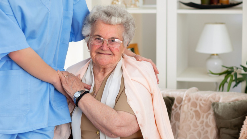 adult patient care - older woman with carer, chronic kidney disease