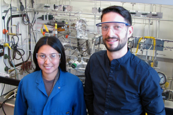 Aisulu Aitbekova, left, and Matteo Cargnello in front of the reactor used in the project.