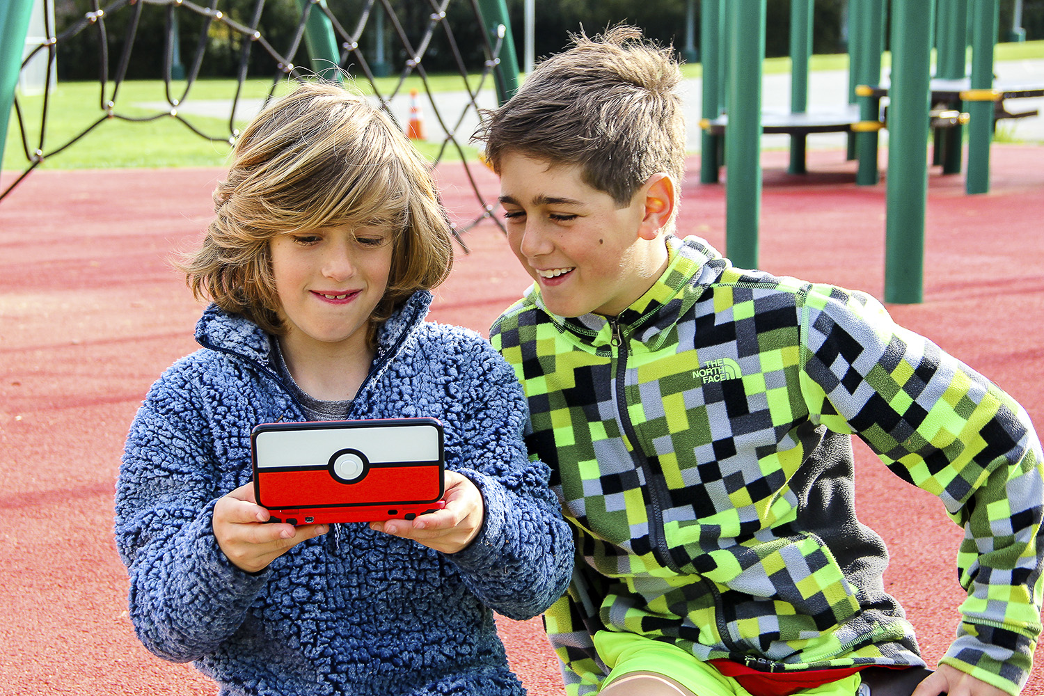 Children play Pokemon.