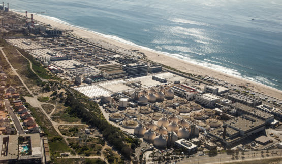 Overhead view of a water reclamation plant on prime seafront real estate.