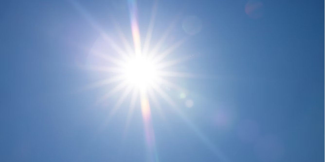 Looking up at the sun on a clear day