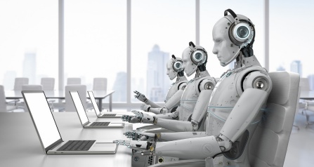 Robots working on computers.