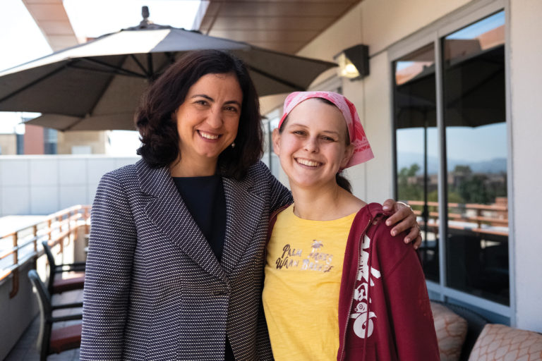 A doctor poses with her patient.