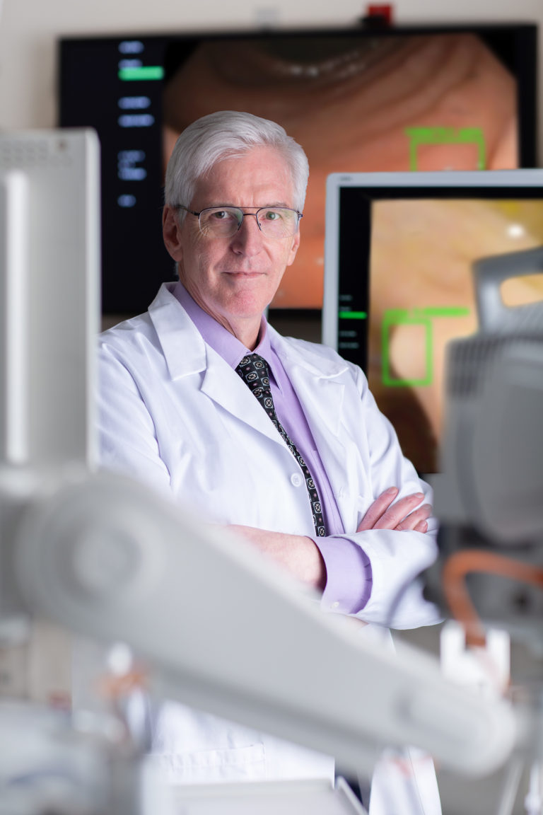 Dr. William Karnes poses in a lab.