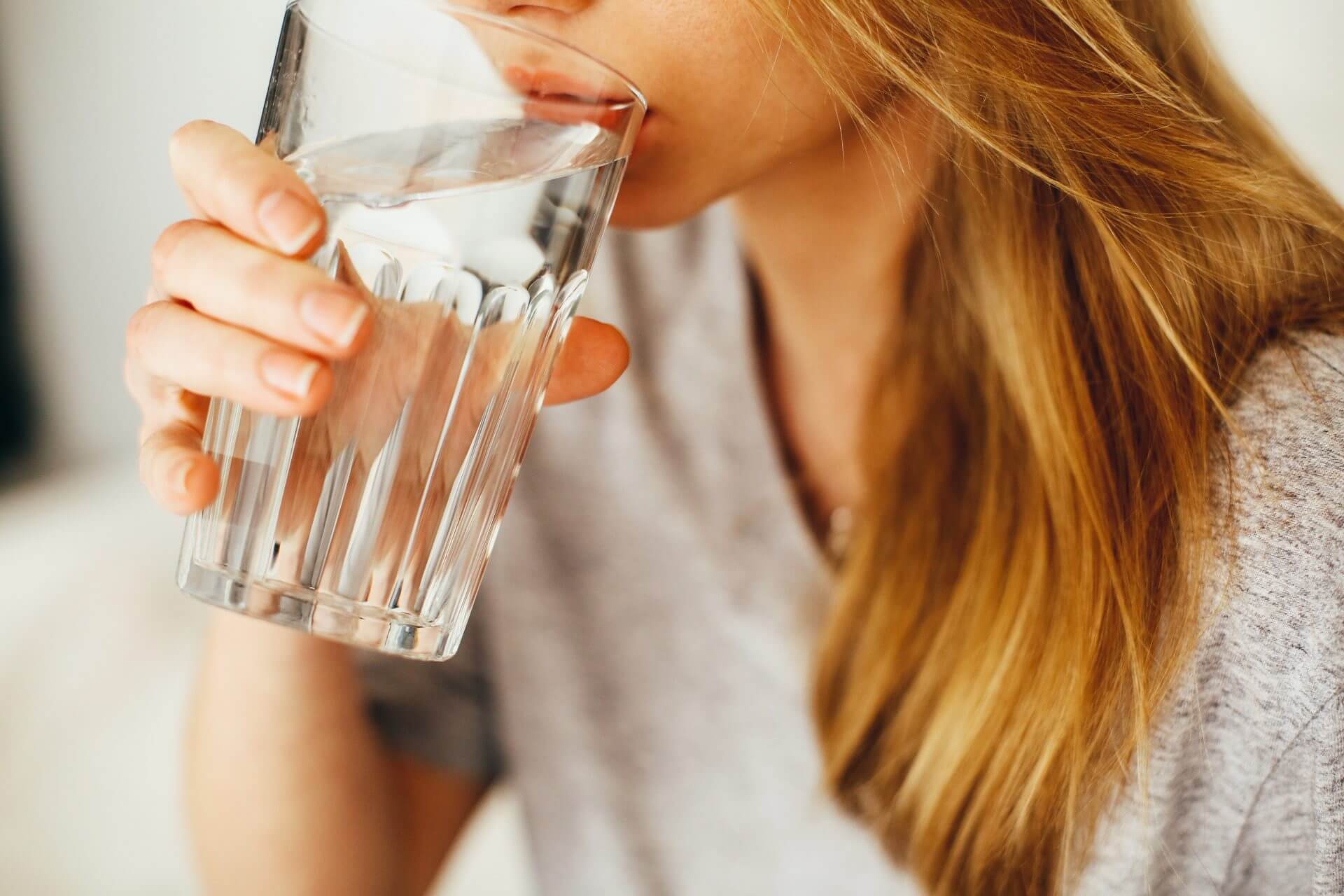 A woman drinks water