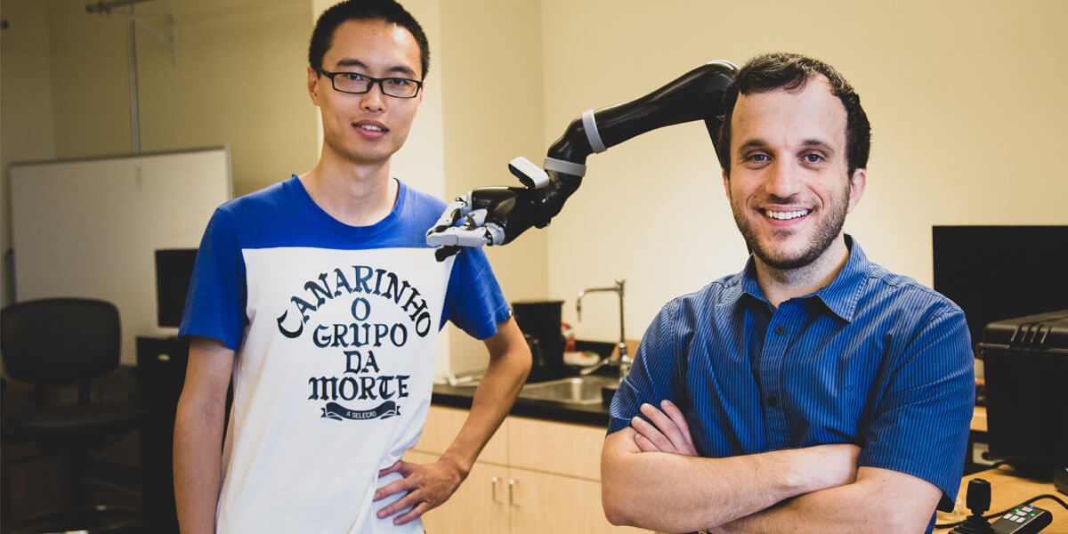 PhD Students Jiali Duan (left) and Stefanos Nikoladis, an assistant professor in computer science.