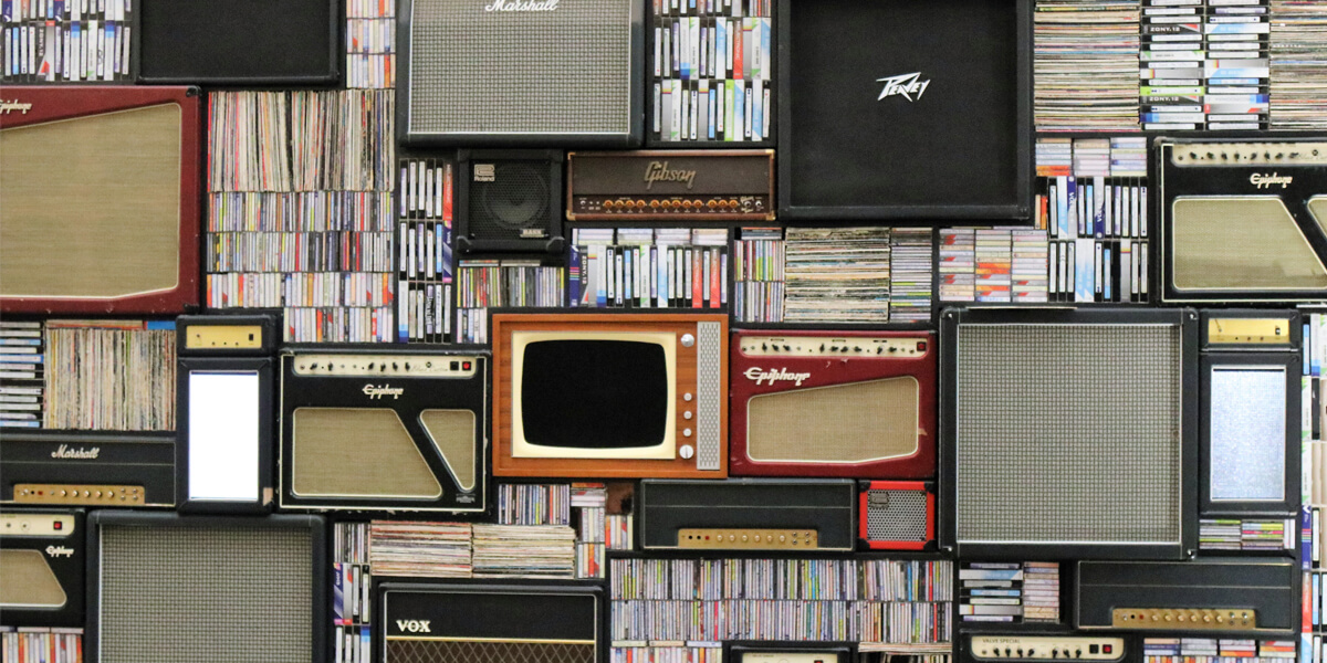 Various musical medium surround a television.