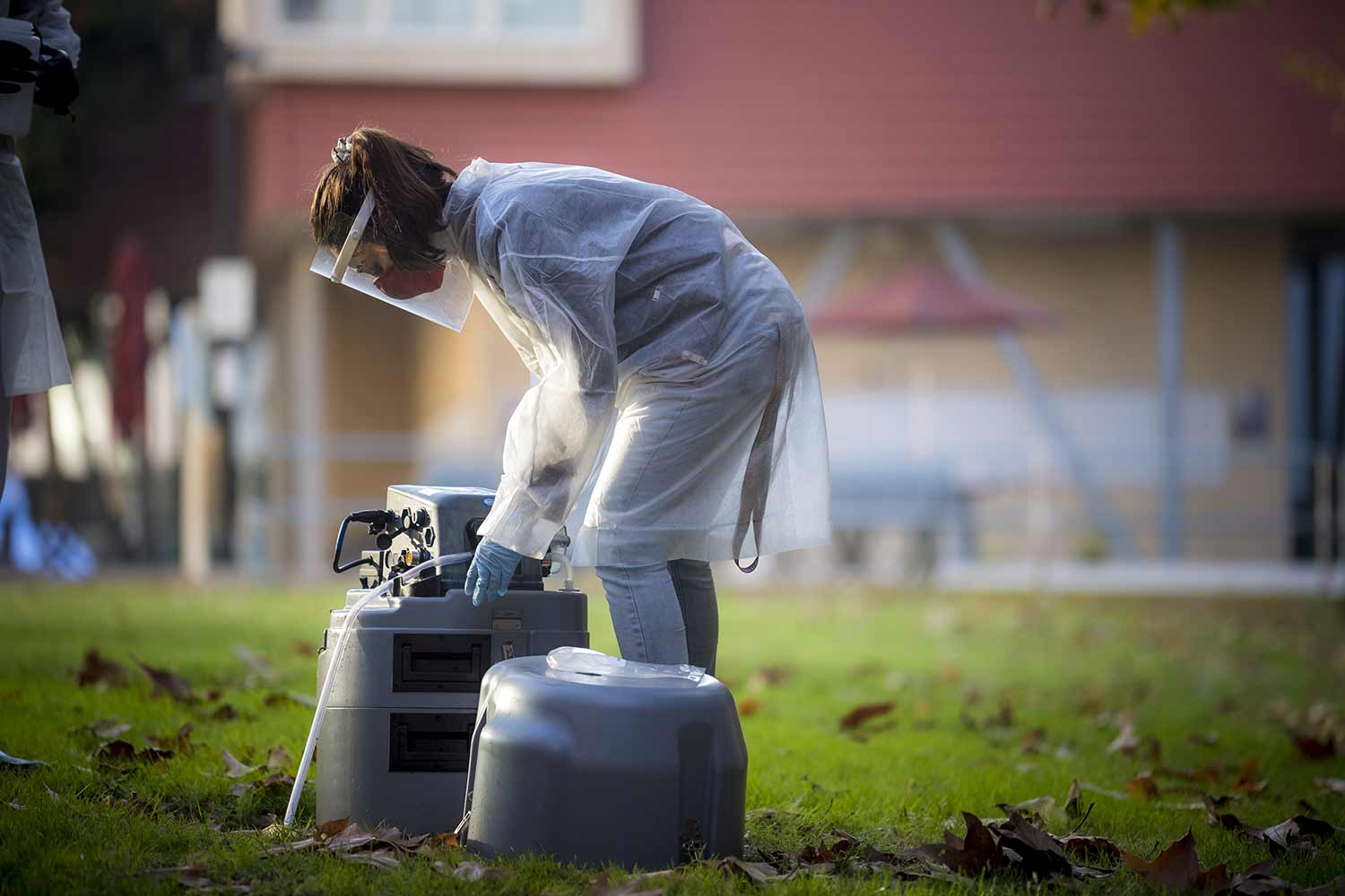 UC San Diego researcher picks up wastewater samples