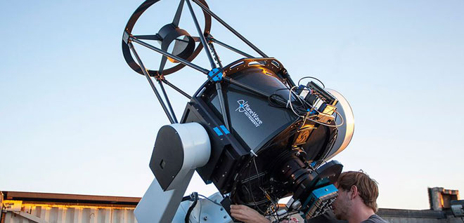 Students using telescope