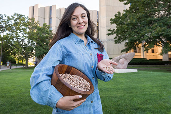 Northwestern student Odette Zero with corn kernals