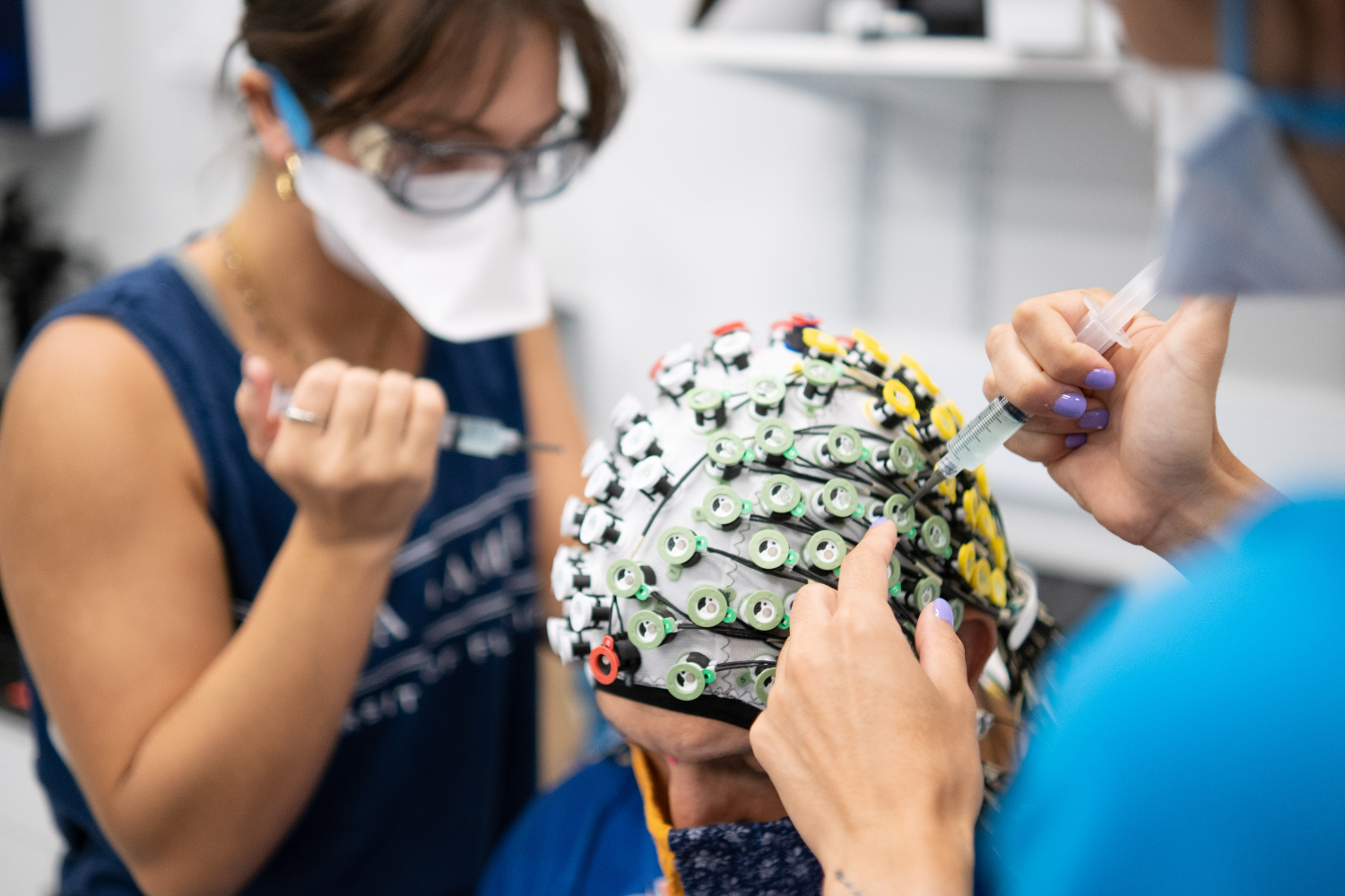 ""Playing sports against robotic opponents makes our brains work harder; More than 100 electrodes capture fine detail of the brain activity of participants while they play a fast-paced game of table tennis. Image by Frazier Springfield.
