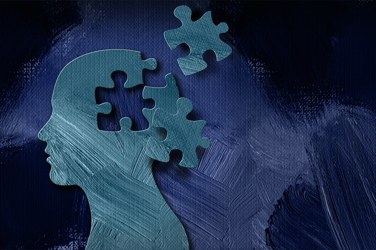 Insights into brain connectivity may help clinicians choose between talk therapy and medications for depression; Digital illustration of a human sillouhette'shead breaking into puzzle pieces