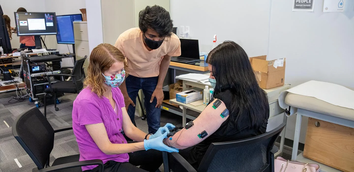 Pitt PhD students played key roles in a new study that helped stroke patients regain hand movement; Photo: PhD students conducting experiments