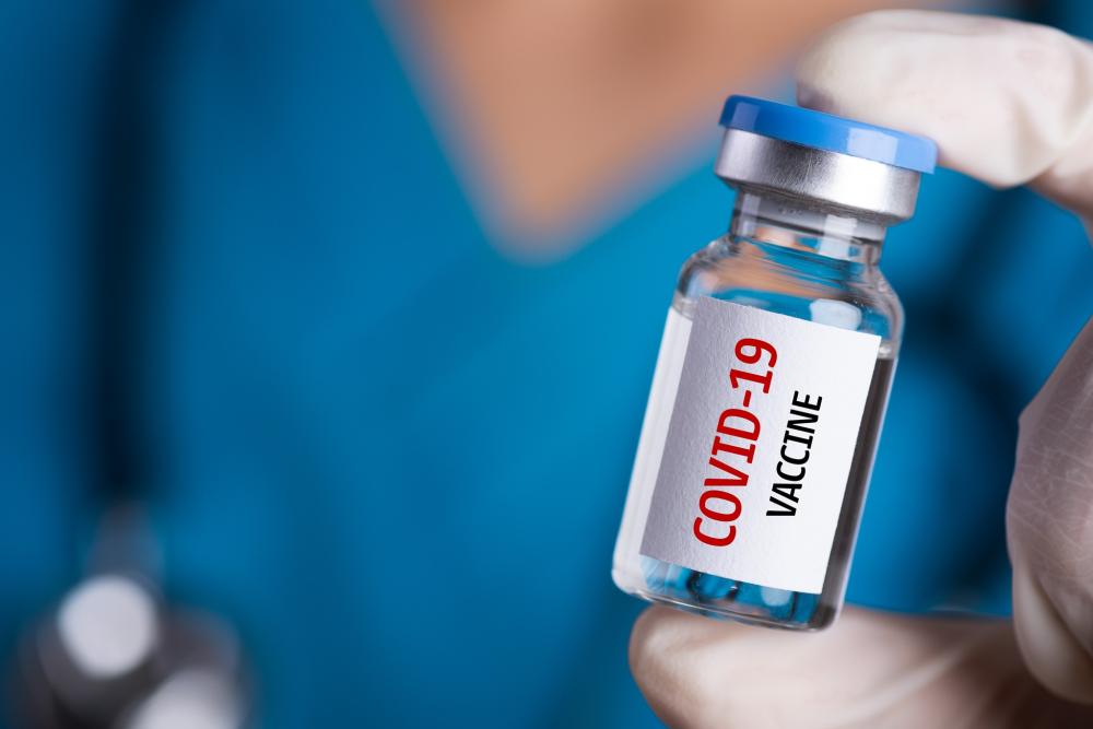 "Discovery at Dartmouth Unlocked COVID-19 Vaccines, Helped Save Millions; Stock photo of Covid-19 Vaccine vial."