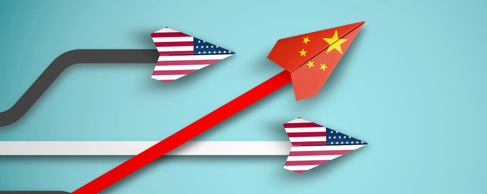Paper airplanes colored with the U.S. and Chinese flags, with the Chinese-flag colored airplane rising above the U.S. flag colored airplanes.